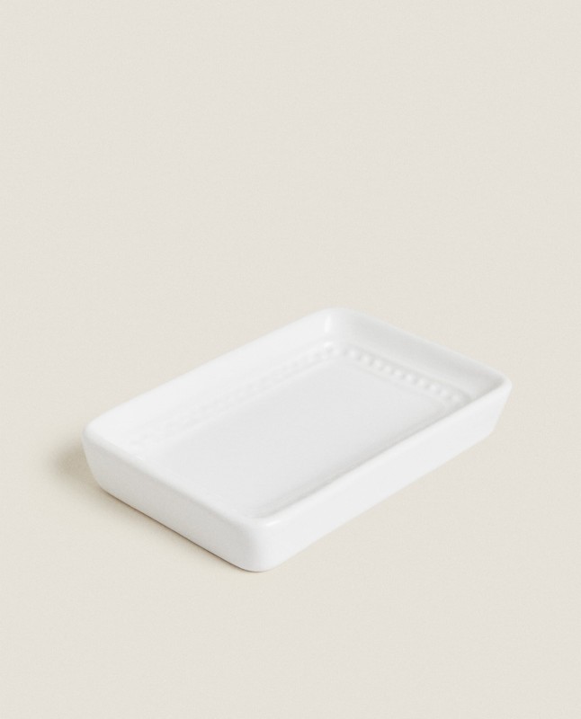 CERAMIC SOAP DISPENSER WITH A RAISED DESIGN
