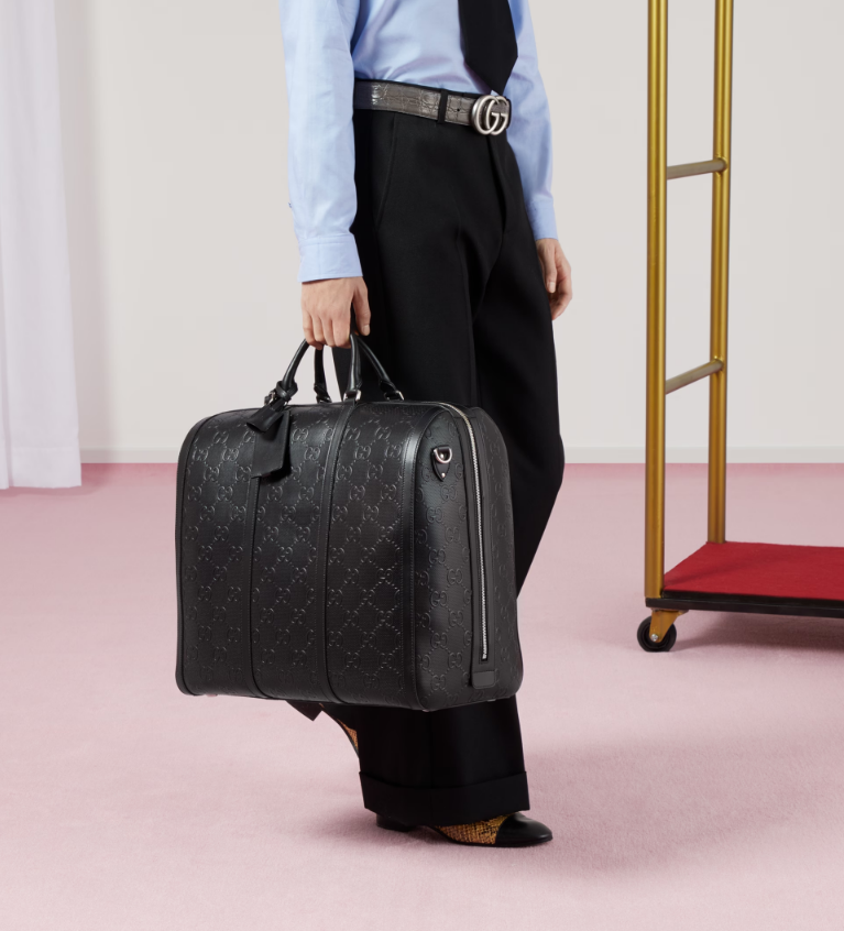 GUCCI GG EMBOSSED DUFFLE BAG